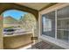 View of the neighborhood from private balcony with table and chairs, perfect for outdoor relaxation at 7950 W Flamingo Rd # 1042, Las Vegas, NV 89147