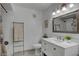 Clean bathroom features marble counters, white cabinets, and a shower-tub combination, offering a refreshing space at 7950 W Flamingo Rd # 1042, Las Vegas, NV 89147