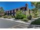 Exterior of a condo complex featuring lush landscaping and a contemporary design at 7950 W Flamingo Rd # 1042, Las Vegas, NV 89147