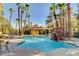 Resort-style community pool with a waterfall feature and ample seating at 7950 W Flamingo Rd # 1042, Las Vegas, NV 89147