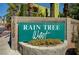 Entrance to the Rain Tree West community featuring a large, attractive sign at 7950 W Flamingo Rd # 1042, Las Vegas, NV 89147