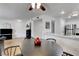 Bright dining area adjacent to the updated kitchen with stainless steel appliances and marble countertops at 7950 W Flamingo Rd # 1042, Las Vegas, NV 89147