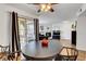 Bright dining area featuring a modern ceiling fan and sliding glass door to a private patio at 7950 W Flamingo Rd # 1042, Las Vegas, NV 89147