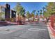 Well-maintained gated community entrance with mature landscaping and convenient resident access at 7950 W Flamingo Rd # 1042, Las Vegas, NV 89147
