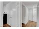 Hallway with wood flooring and access to closets and other rooms at 7950 W Flamingo Rd # 1042, Las Vegas, NV 89147