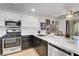 Updated kitchen with two-tone cabinets, a modern faucet, stainless steel appliances, and plenty of counter space at 7950 W Flamingo Rd # 1042, Las Vegas, NV 89147