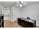 The well-lit bedroom, complemented by a ceiling fan, transforms into a functional office, ready for productivity at 7950 W Flamingo Rd # 1042, Las Vegas, NV 89147
