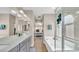 Spacious bathroom with double vanity, bathtub, and separate glass shower enclosure at 8139 Skytop Ledge Ave, Las Vegas, NV 89178