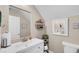Cozy half bathroom features a modern sink, mirror, decorative shelves, and toilet at 8139 Skytop Ledge Ave, Las Vegas, NV 89178