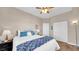 Inviting bedroom featuring a plush bed with throw, and warm lighting at 8139 Skytop Ledge Ave, Las Vegas, NV 89178