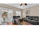 Comfortable living area with a ceiling fan, sliding glass doors to outdoor space, and stylish decor at 8139 Skytop Ledge Ave, Las Vegas, NV 89178