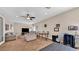 Living room with neutral walls, ceiling fan, a television, and comfortable furniture at 8139 Skytop Ledge Ave, Las Vegas, NV 89178
