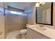Bathroom with glass shower, single sink vanity, and neutral walls at 8729 Pesaro Dr, Las Vegas, NV 89117