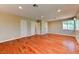 Spacious bedroom featuring hardwood floors, recessed lighting, and multiple doors at 8729 Pesaro Dr, Las Vegas, NV 89117