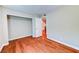 Bedroom with wood floors, a closet with a hanging rod, and a doorway to another room at 8729 Pesaro Dr, Las Vegas, NV 89117
