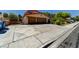 View of the long driveway leading to the home's garage at 8729 Pesaro Dr, Las Vegas, NV 89117