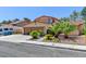 Charming single-Gathering home boasting a two-car garage and well-manicured landscaping at 8729 Pesaro Dr, Las Vegas, NV 89117