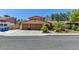 Charming single-Gathering home boasting a two-car garage and well-manicured landscaping at 8729 Pesaro Dr, Las Vegas, NV 89117