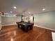 Large game room with wood floors, pool table, and view to other parts of the house at 8729 Pesaro Dr, Las Vegas, NV 89117