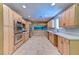 Spacious kitchen with stainless steel appliances, custom cabinets, and tile flooring at 8729 Pesaro Dr, Las Vegas, NV 89117