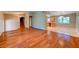 Open-concept living space featuring hardwood floors connecting to a bright kitchen at 8729 Pesaro Dr, Las Vegas, NV 89117