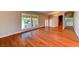 Bright living area with hardwood flooring and large windows offering lots of natural light at 8729 Pesaro Dr, Las Vegas, NV 89117