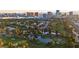 Gorgeous aerial view of lush golf course and serene lakes with city skyline at 882 Tam O Shanter, Las Vegas, NV 89109