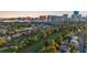 Aerial view of the community, golf course, and the stunning Las Vegas skyline at 882 Tam O Shanter, Las Vegas, NV 89109