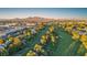 Community aerial showcasing golf course, trees and desert mountain views at 882 Tam O Shanter, Las Vegas, NV 89109