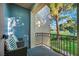 Cozy balcony featuring two chairs and a beautiful view of the green golf course at 882 Tam O Shanter, Las Vegas, NV 89109