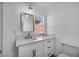 Charming bathroom with modern vanity, stylish mirror, and fixtures beneath a bright window at 882 Tam O Shanter, Las Vegas, NV 89109