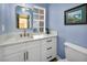 Charming blue bathroom with white cabinets, marble countertops, and modern fixtures at 882 Tam O Shanter, Las Vegas, NV 89109