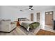 Spacious bedroom with a bed, sitting chair and modern furnishings at 882 Tam O Shanter, Las Vegas, NV 89109