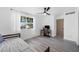 Bright bedroom with ample natural light features a modern ceiling fan, and wood-look floors at 882 Tam O Shanter, Las Vegas, NV 89109