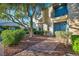 Inviting two-story townhome with a charming balcony and well-manicured landscaping at 882 Tam O Shanter, Las Vegas, NV 89109