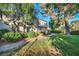 Serene townhome exterior with private balcony, lush lawn, and peaceful ambiance at 882 Tam O Shanter, Las Vegas, NV 89109