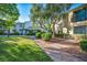 Charming townhome with private balcony, brick walkway, and mature trees in a tranquil setting at 882 Tam O Shanter, Las Vegas, NV 89109