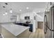 Modern kitchen features white cabinets, marble countertops, stainless steel appliances, and modern lighting at 882 Tam O Shanter, Las Vegas, NV 89109