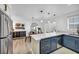 Well-lit kitchen area with marble countertops, sleek appliances, and open dining area at 882 Tam O Shanter, Las Vegas, NV 89109