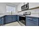 Bright kitchen features modern appliances, white cabinets, marble countertops, and modern lighting at 882 Tam O Shanter, Las Vegas, NV 89109