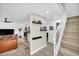 Open living area leads to the staircase with a view of the kitchen and dining room at 882 Tam O Shanter, Las Vegas, NV 89109