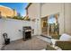 Private patio with comfortable seating and stainless steel grill near sliding glass door at 882 Tam O Shanter, Las Vegas, NV 89109