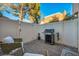 Private patio with comfortable seating and stainless steel grill for outdoor dining at 882 Tam O Shanter, Las Vegas, NV 89109
