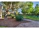 Landscaped courtyard featuring mature trees and manicured hedges at 882 Tam O Shanter, Las Vegas, NV 89109