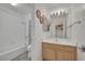 Bathroom includes a tub, toilet, sink and small mirror at 9180 Mohawk St, Las Vegas, NV 89139
