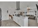 Open-concept kitchen island flows into the dining and living areas of this spacious home at 9180 Mohawk St, Las Vegas, NV 89139