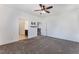 Bright bedroom showcasing neutral walls, comfortable carpet, and easy access to a bathroom and closet at 9850 Poplar Point Ave, Las Vegas, NV 89178