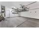Spacious garage with epoxy floors, built-in storage racks, and water heater at 9850 Poplar Point Ave, Las Vegas, NV 89178