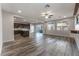 The open-concept living room boasts abundant natural light and modern flooring, seamlessly connecting indoor and outdoor spaces at 9850 Poplar Point Ave, Las Vegas, NV 89178