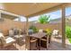 Inviting covered patio features a dining area, lounge seating, and a built-in BBQ for outdoor entertaining at 10160 Tree Blossom Ave, Las Vegas, NV 89166